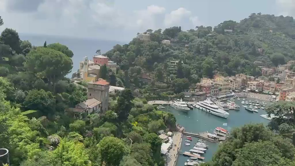 Panoramic video of Portofino harbour from above, surrounded by green Ligurian hills